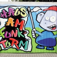 Ein Grafitti an der Wand bei dem Haus Am Funkturm von Bethel.regional in Dortmund